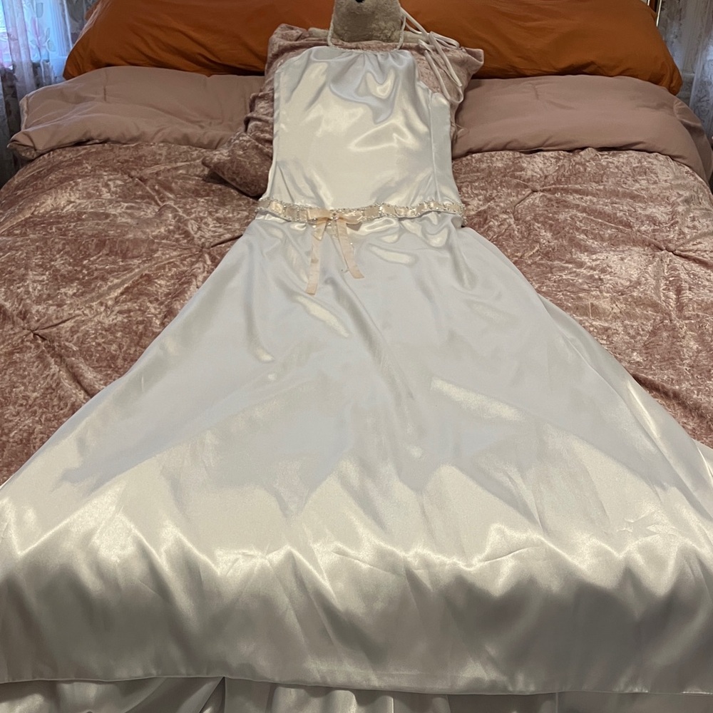 Exquisite  white satin designer dress with halter front. Beaded tie neck. Very